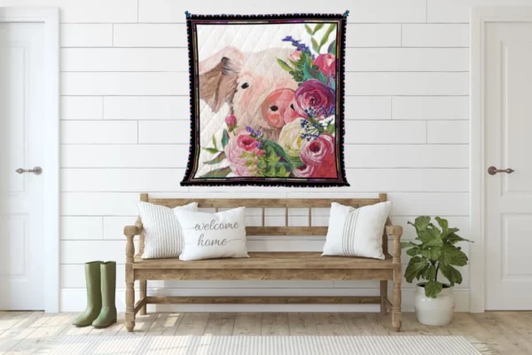 a farmhouse quilt hang on a white wall over a chair with white pillows
